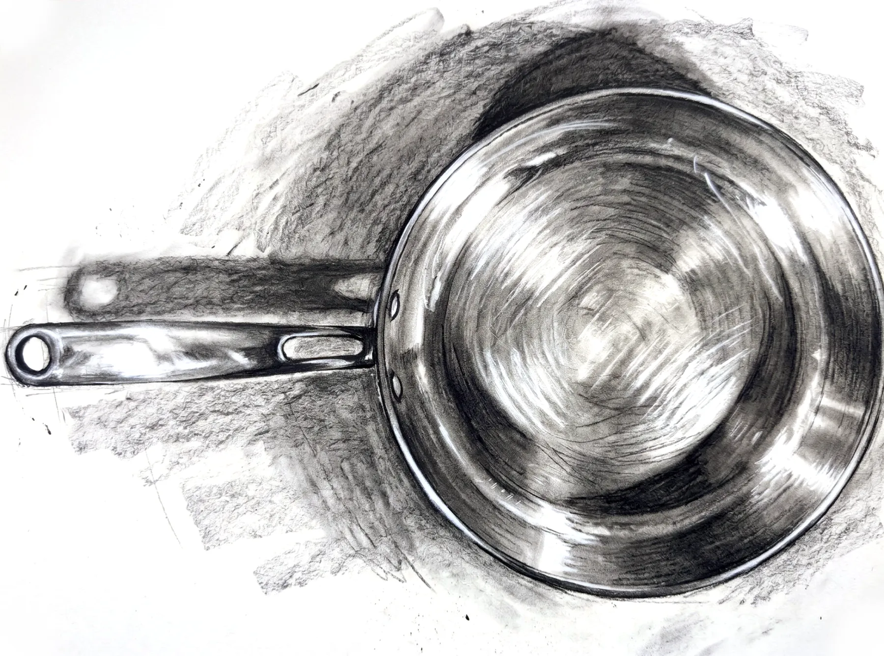 Dibujo al carboncillo de un sartén visto desde arriba
